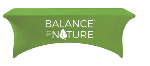Green table cover with a large white Balance of Nature wordmark